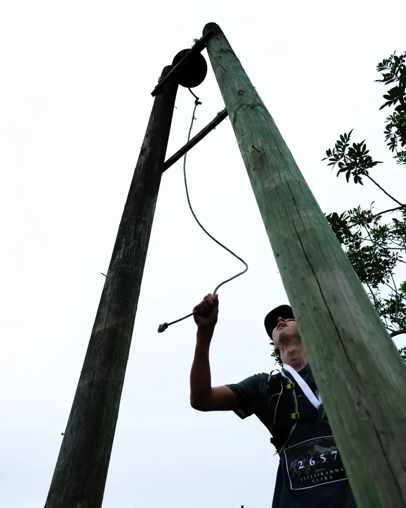 Runner ringing the finish bell